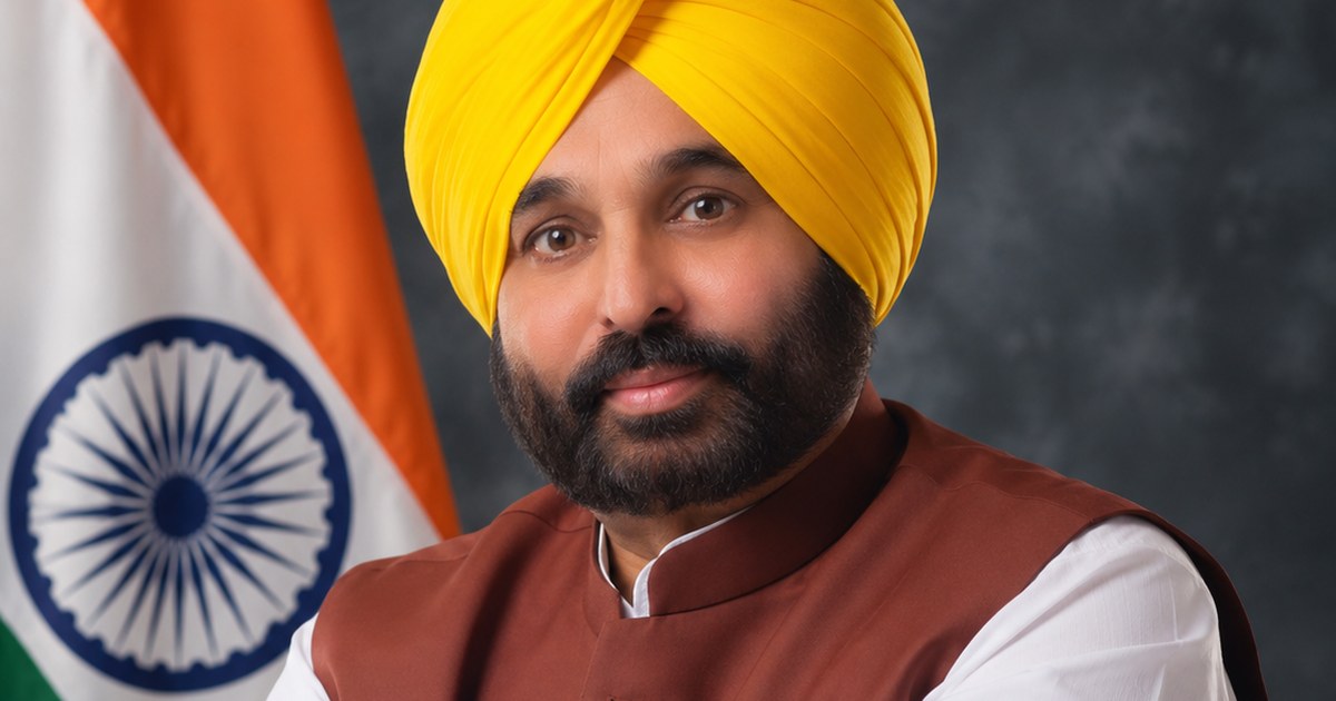 Bhagwant Mann, Punjab chief minister, poses in a yellow turban with the Indian flag behind him in this 2026 portrait
