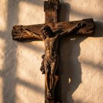 Editorial illustration of a large wooden crucifix hanging on a church wall, similar to the one that fell in Guayaquil